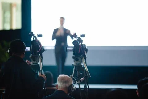 Video camera set record speaker and audience in conference hall seminar event Stockfoto's