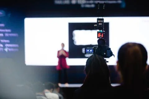 Video camera set record speaker and audience in conference hall seminar event Stock Photos