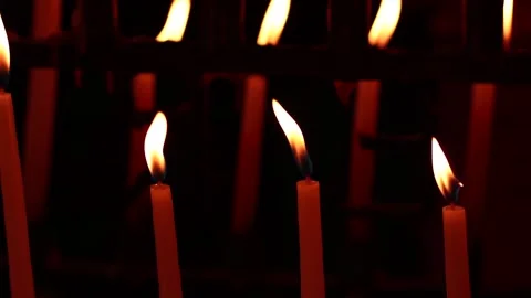 Video of candles lit together. Concept of religion, faith and spirituality. Stock Footage 232399662