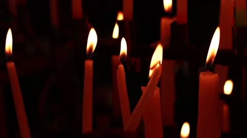 Video of candles lit together. Concept of religion, faith and spirituality. Stock Footage 232420941