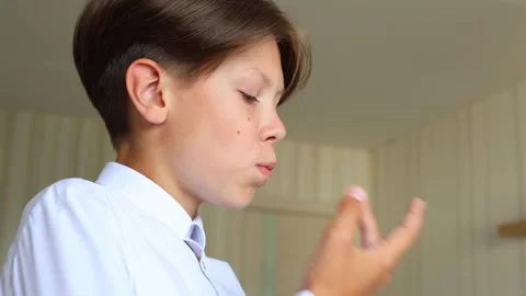 The video captures a close-up of him placing the aligner into his mouth Video stock 287316753