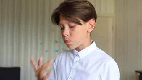 The video captures a close-up of him placing the aligner into his mouth Video stock 287707243