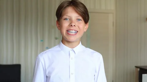 The video captures a close-up of him placing the aligner into his mouth Stock Footage 288193690
