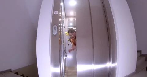 A video captures dynamic moments with an elevator and its users Stock Footage 313564526