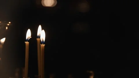 Video captures sequence of three candles burning steadily Stock Footage 326068520