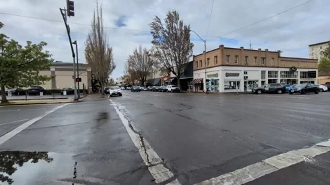 Video capturing a bustling downtown intersection with moving traffic Stock Footage 340360166
