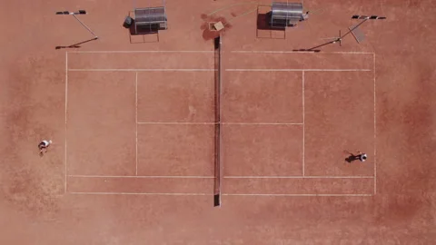 Video capturing with drone in a sunny day at the tennis court outside two 스톡 동영상 208083843