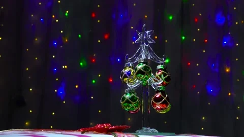 Video card with a small Christmas tree on a gift Video stock 144610174