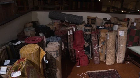 Video of carpets with a geometric pattern displayed in the store on the market . Stock Footage 128552274