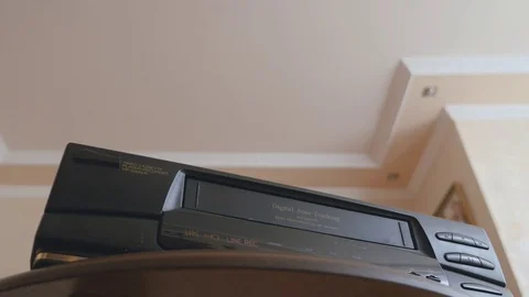 Video cassette inserted into a VHS/S-VHS videorecorder Stock Footage 78118844