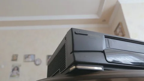 Video cassette loaded in VCR Stock Footage 79571165