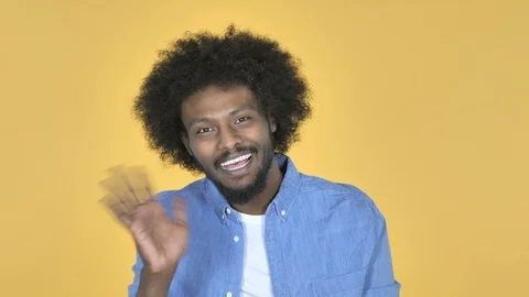Video Chat by Afro-American Man on Yellow Background, Talking Stock-Footage 99222389