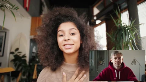 Video chat communication during lockdown. Young black mix raced couple having Stock Footage 166323191