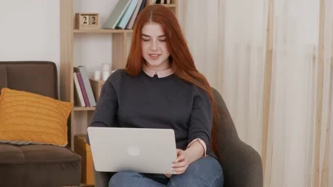 Video chat job interview or distance course with red hair female online teacher. Stock Footage 148752583
