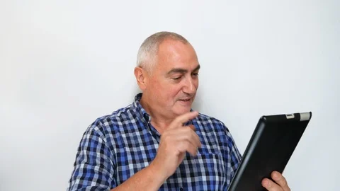Video chat by middle aged man via tablet isolated on white background. Stock Footage 115417469