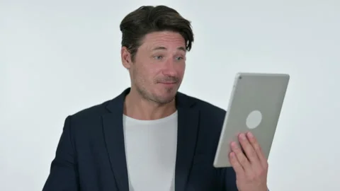 Video Chat on Tablet by Middle Aged Businessman, White Background Video stock 141682917