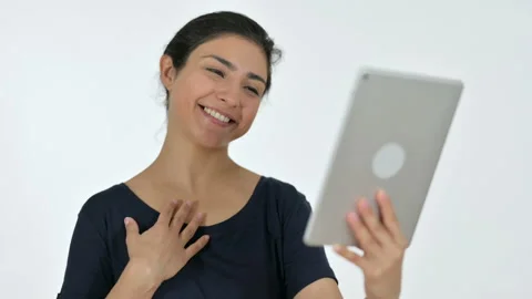 Video Chat on Tablet by Young Indian Woman, White Background Video stock 141684340
