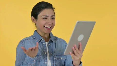 Video Chat on Tablet by Young Indian Woman, Yellow Background 스톡 동영상 141685103