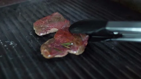 Video Of Checking Steaks On The Grill In Real Slow Motion Video stock 196159418