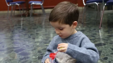 Video of a child blowing soap bubbles and enjoying Stock Footage 151555443