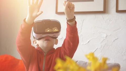 Video of child exploring virtual reality and playing games in 4k slow motion Stock Footage 80230090