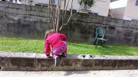 Video of child playing on sidewalk Stock Footage 221509503