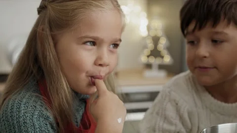 Video of child tasting sugar paste during Christmas baking Stock Footage 141427716