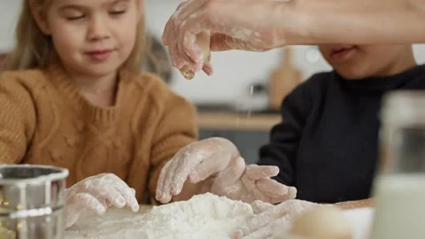Video of children looking at egg cracked by mom Stock Footage 141428752