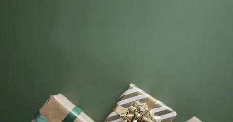 Video of christmas presents with copy space on green background Stock Footage 341560164