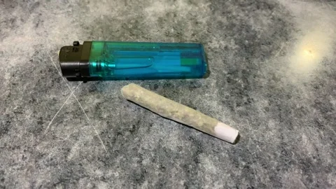 Video of cigar made of marijuana on a table. Drug concept. Stock Footage 252711893