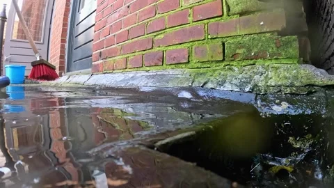 Video cleaning and scrubbing deck and pushing water into drain. 스톡 동영상 332800814