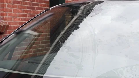 Video cleaning windshield with wipers on car. Stock Footage 341681827