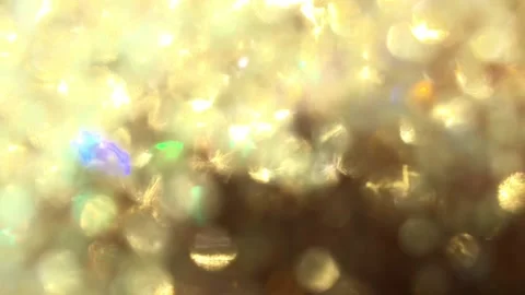 Video clip of blurred close-up golden glitter ball in full-frame Stock Footage 120501094