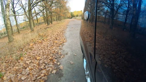 Video clip of a car driving through the countryside. Stock Footage 144427719