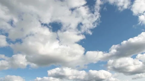 Video clip features a time lapse of beautiful soft and white clouds on a blue Stock Footage 160833412