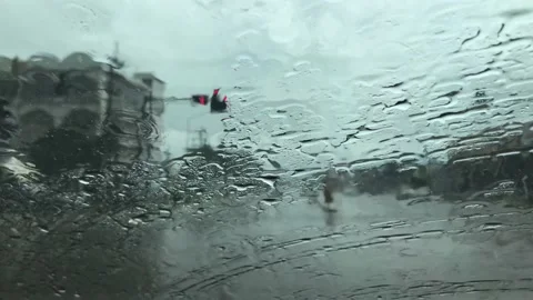 Video clip of rain falling on the windshield Stock Footage 140565157