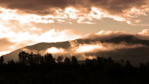 Video clip shows a time lapse of a mountain and clouds in the early morning Stock Footage 160670472
