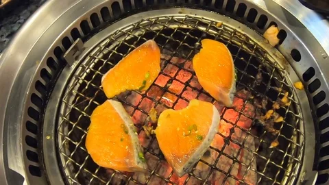 Video clip slow motion Salmon Buffet Grilling on the stove Stock Footage 100978454