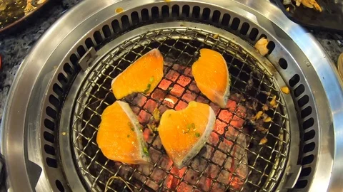 Video clip slow motion Salmon Buffet Grilling on the stove Stock Footage 101365960