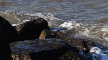 Video clip of waves breaking over rocks Stock Footage 85718714