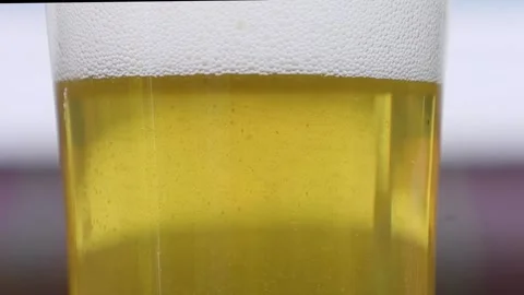 Video close up of beer with bubbles and foam or froth. Stock Footage 345069513