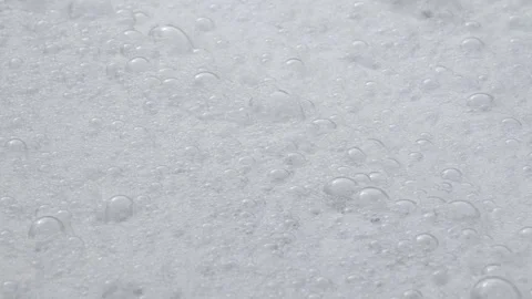 In this video, a close-up captures many bubbles and white foam. Stock Footage 263921856