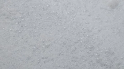 In this video, a close-up captures many bubbles and white foam. Vídeos de archivo 263921885