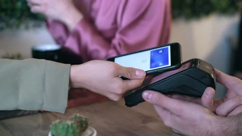 Video of close up of customer using her credit card to make payment with elec Video stock 213293674