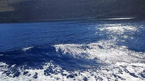 Video close up of a deep blue water waves moving behind fast moving ferry Stock Footage 308412519
