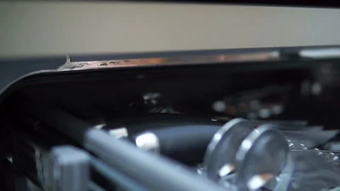 Video close focus transition from cuterly tray to power button and energy Stock Footage 219433798