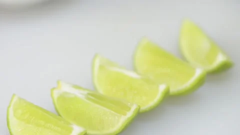 Video Close up of green lime sliced and grouped Stockbeeldmateriaal 166919661
