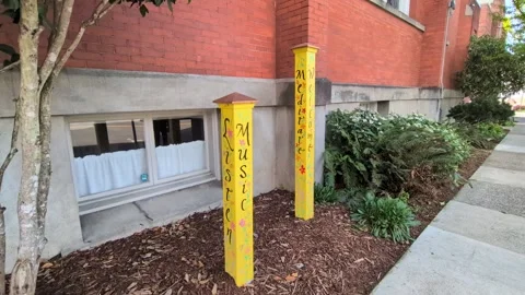 Video close-up of handcrafted painted poles displaying inspirational words Video stock 335242536