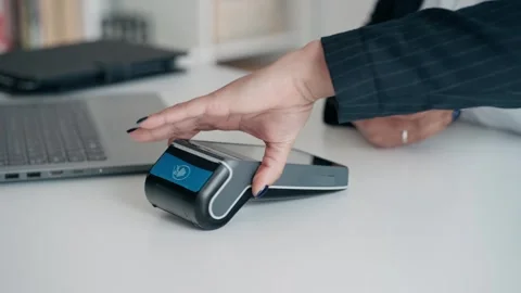 Video close up of hands charging with dataphone and paying with card Video stock 247116365