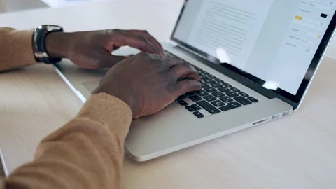 Video of close up of hands of concentrated black business man working with la Stock Footage 153775191